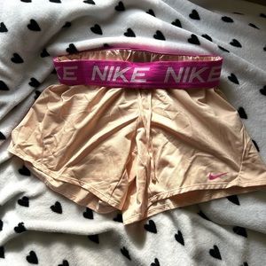 baby pink nike athletic shorts, size xs but fits perfect on a size s too